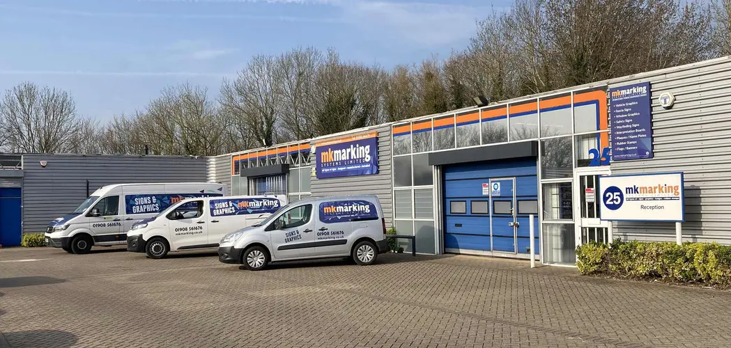 Mk Marking building exterior with vans outside